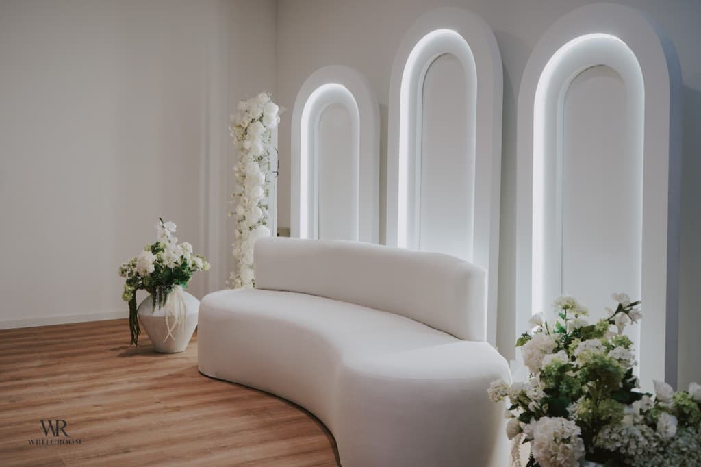 White Room Lounge with elegant arches and white sofa
